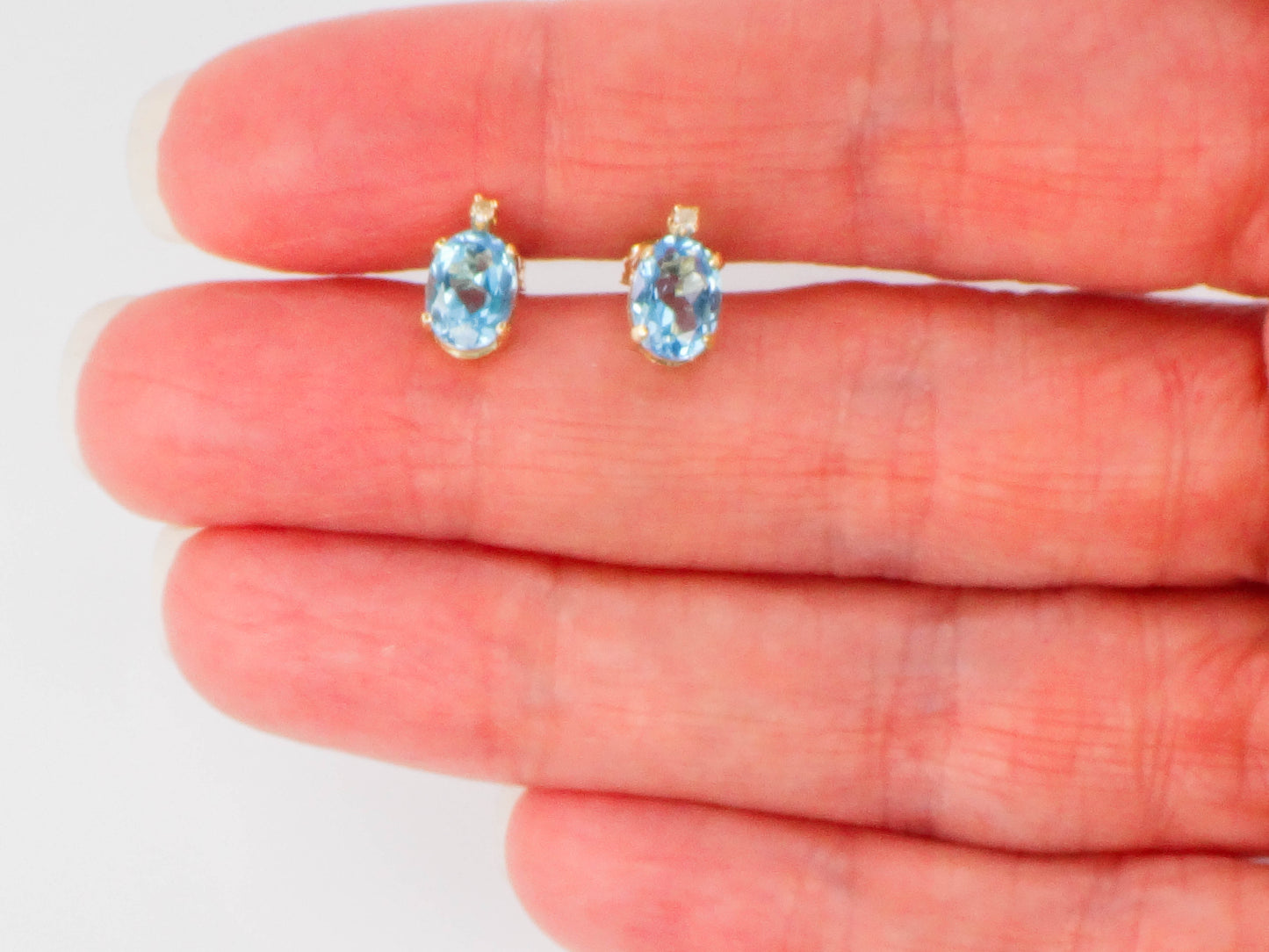 Pre-Owned 14k Yellow Gold Blue Topaz Stud Earrings with White Sapphire Accents, Oval December Birthstone Studs
